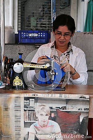 Woman at Work in a Garments Shop Editorial Stock Photo