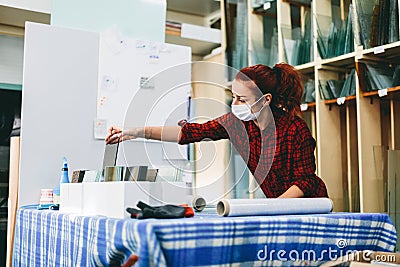 Woman worker packing products for shipment Stock Photo