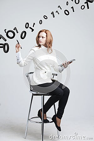 Woman working with binary code, concept of digital technology. Stock Photo