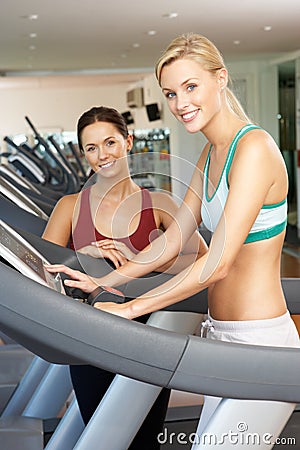 Woman Working With Female Personal Trainer Stock Photo
