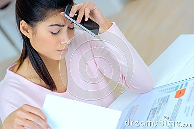 Woman working on finances worried about expend cost Stock Photo