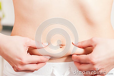 Woman working on her love handles Stock Photo