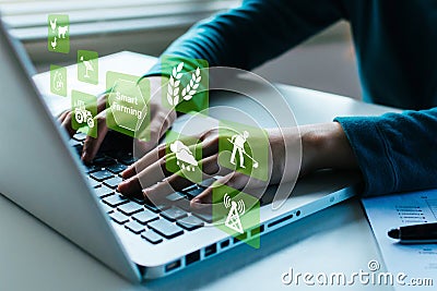 woman working on laptop computer with virtual graphic icon diagram Stock Photo