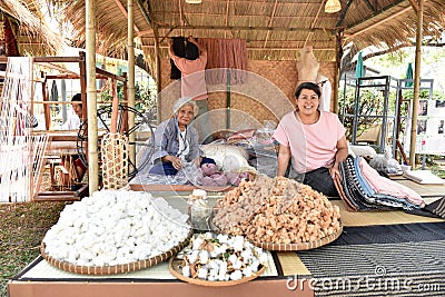 Woman working at the manufacturer of cotton. Editorial Stock Photo