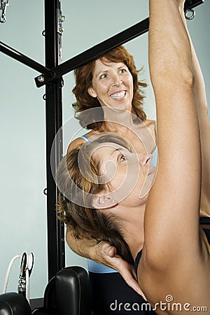 Woman Working Out With Personal Trainer Stock Photo