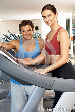 Woman Working With Personal Trainer Stock Photo