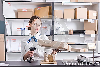 Woman working at the post office Stock Photo