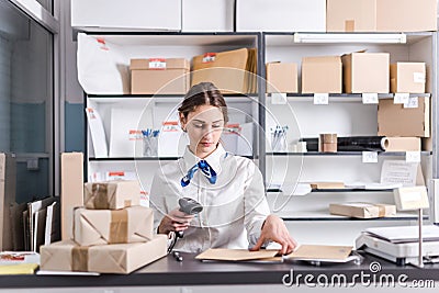 Woman working at the post office Stock Photo