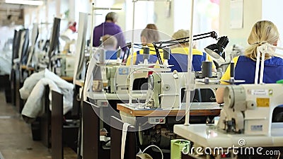 Woman Working at a Sewing Machine, Industrial Size Textile Factory ...