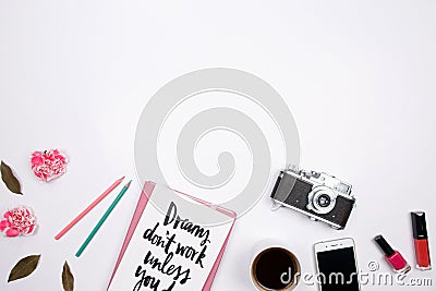 Woman workspace with handwritten quote notebook, pink carnation Stock Photo