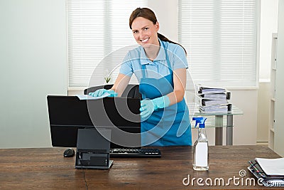 Woman In Workwear Rubbing Computer Stock Photo