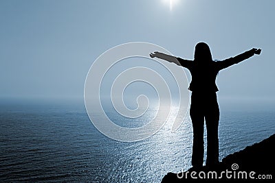 Woman in worship position Stock Photo