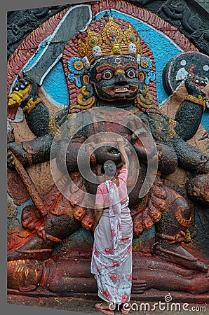 Woman Worshiping A God, Napal, Kathmandu, Durabar Square Editorial Stock Photo