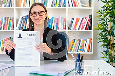 Woman writing curriculum resume for job interview Stock Photo