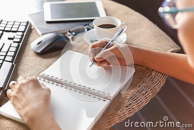 Woman writing shot memories note on white paper with relaxing ti Stock Photo