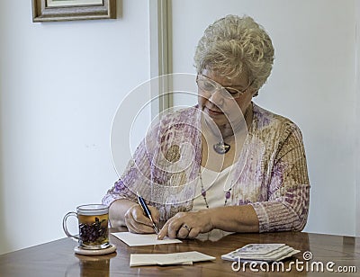Woman writing thank you notes Stock Photo
