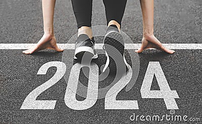 Woman& x27;s feet ont the road, begin to run, fstart of New year 2024, planning, goal, and new year resolution. Stock Photo