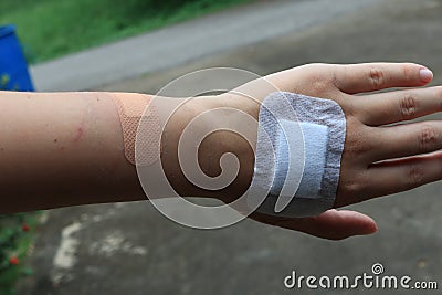 Woman& x27;s hand wound, accidental wound, medical concept, gauze bandage on the hand Stock Photo