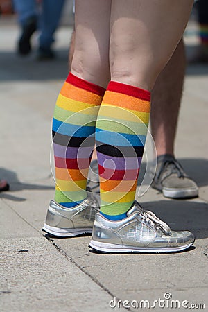 A woman& x27;s legs with rainbow socks and silver shoes at San Diego gay pride parade Stock Photo