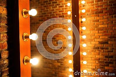 Woman's makeup place with mirror and bulbs Stock Photo