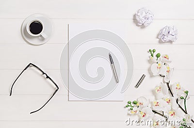 Woman's table, desk or workspace seen from above. Top view background with white wood and copy space Stock Photo