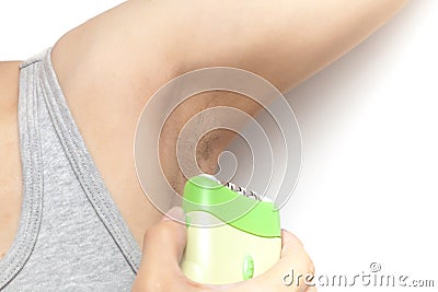 Woman& x27;s using hair remover to remove armpit& x27;s hairy on white background isolated Stock Photo