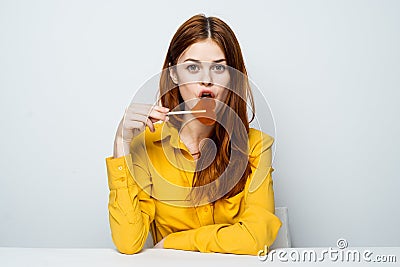 woman in yellow shirt lollipop heart charm lifestyle Stock Photo