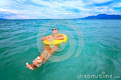 Woman with yellow tube Stock Photo