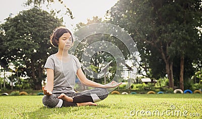 woman yoga and meditate in the lotus position at park Stock Photo