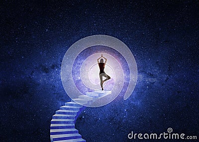 Woman yoga stairs to the universe Stock Photo