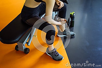 Woman young asian holding dumbbell without rack for workout exercise muscle Stock Photo
