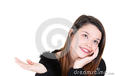 Woman young showing your product in palm hand looking up side Stock Photo