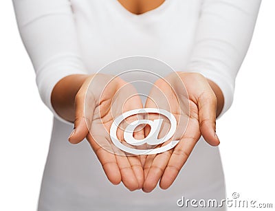 Womans cupped hands showing e-mail cutout sign Stock Photo