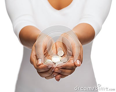 Womans cupped hands showing euro coins Stock Photo