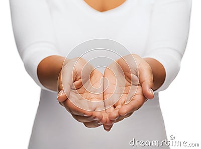 Womans cupped hands showing something Stock Photo