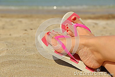 Womans feet with flip flops Stock Photo