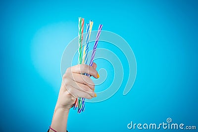 Womans hand holding straws Stock Photo