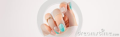 Womans hand with trendy turquoise manicure with copy space Stock Photo