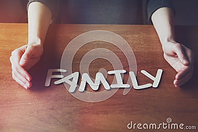 Womans hands with Family word Stock Photo