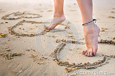 Womans legs on beach Stock Photo