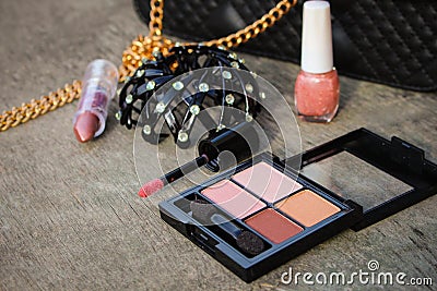 Women accessories: eyeshadow, nail polish, clip hair, handbag Stock Photo