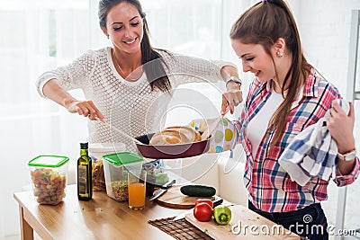 Women baking at home fresh bread in kitchen Stock Photo