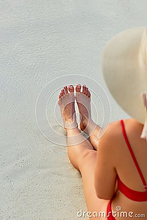 Women Beautiful Sexy Legs on the Beach. Skin care and Protection Sun. Spa Concep. Epilation Laser or Shaving Concept Stock Photo