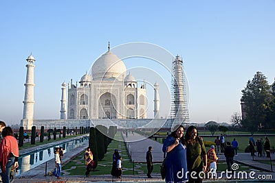 Women being photographed at the Taj Mahal in the early morning Editorial Stock Photo