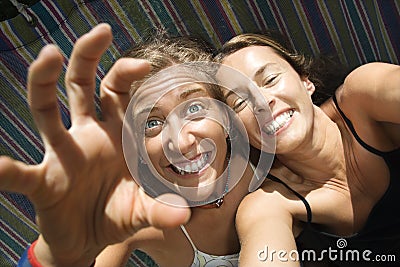 Women being silly in hammock. Stock Photo