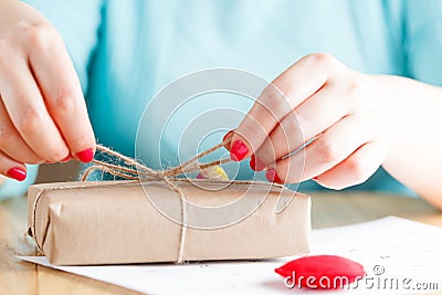 Women binds classic bow for gift Stock Photo