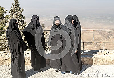 Women with black veil on Mount Nebo Editorial Stock Photo
