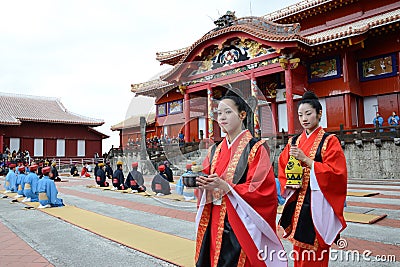 Women carry the bottle of sake Editorial Stock Photo