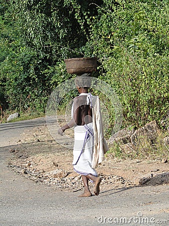 Women carry goods on their head Editorial Stock Photo