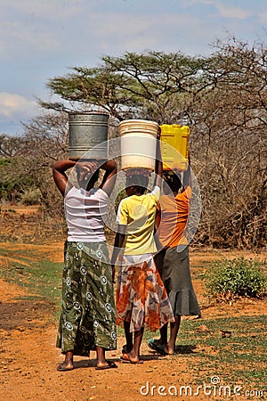 Women carry water to the village, Victoria falls, Zambia Editorial Stock Photo